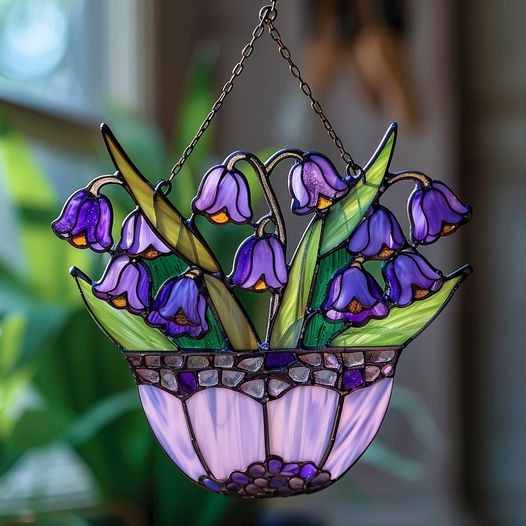 This beautiful pot is filled with charming purple flowers, creating a serene and elegant ambiance.