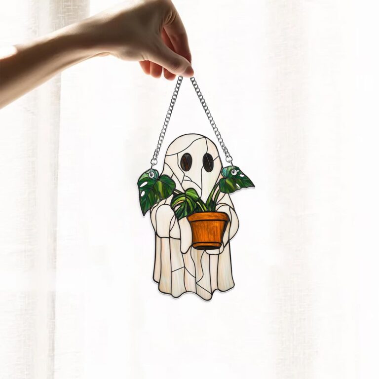 Cute ghost stained glass art piece holds a potted plant, bringing a playful mix of spooky and green to any space